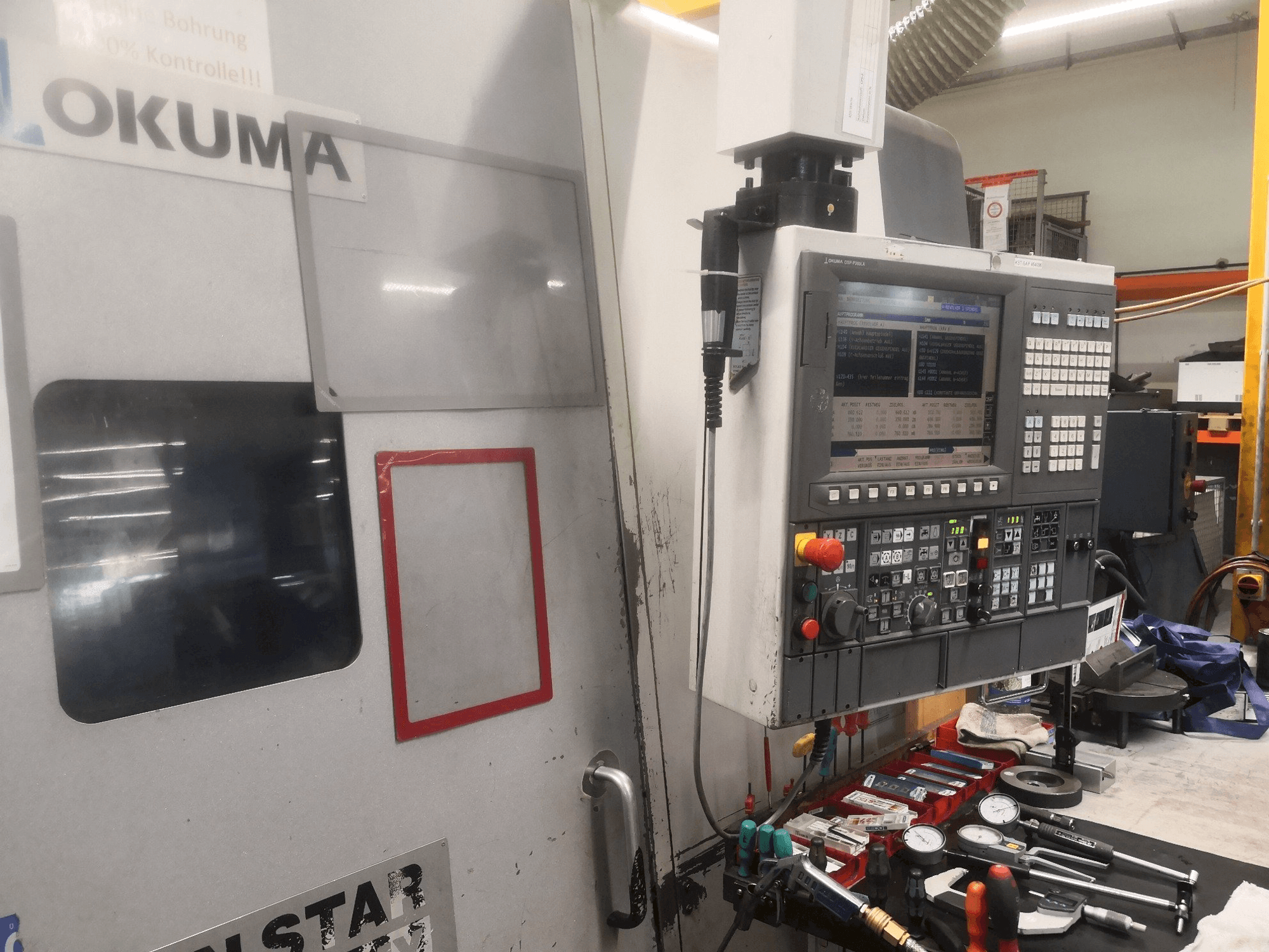 Front view of Okuma LT 300 MY machine