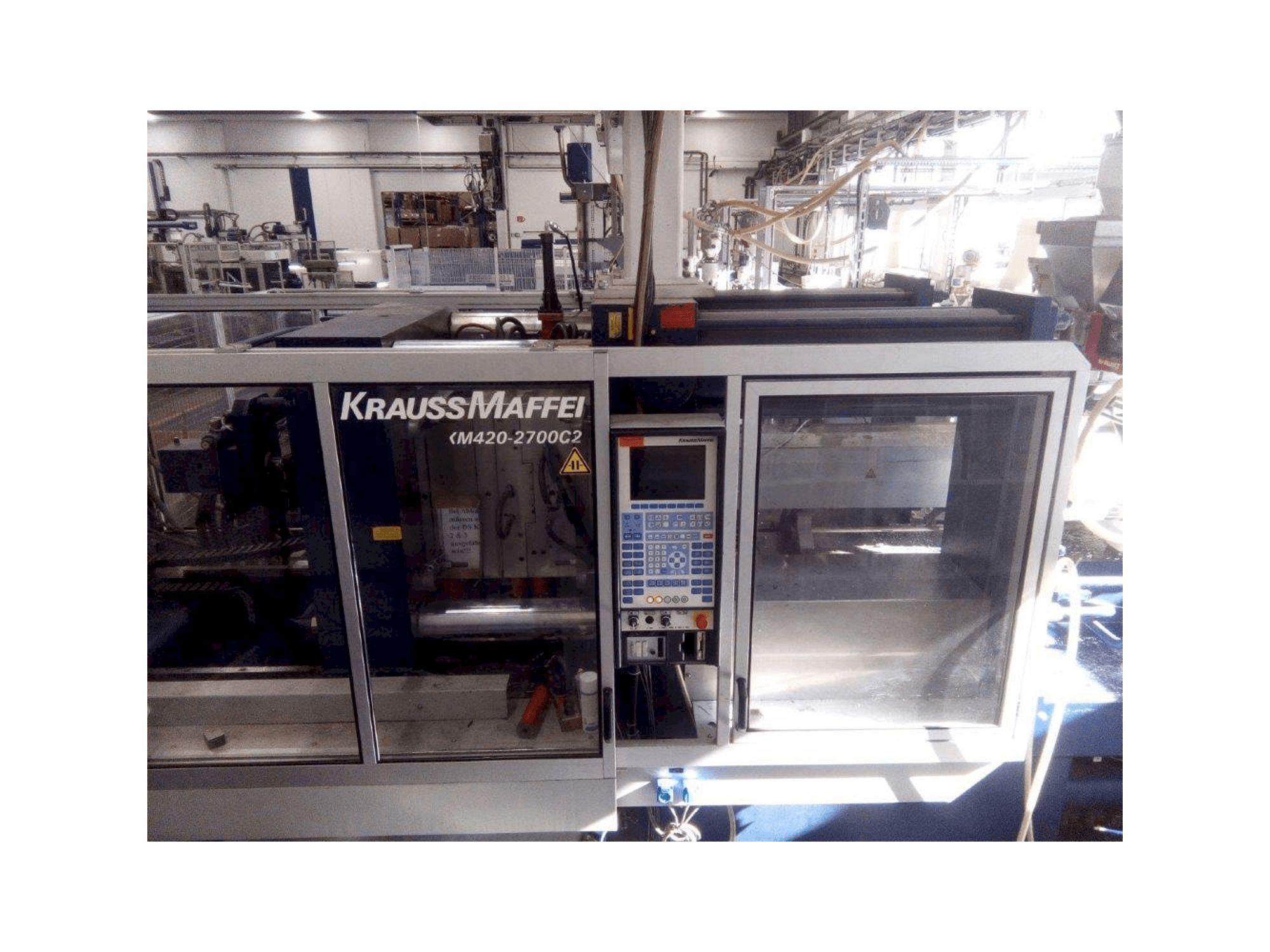 Front view of Krauss Maffei KM 420/2700 C2 machine