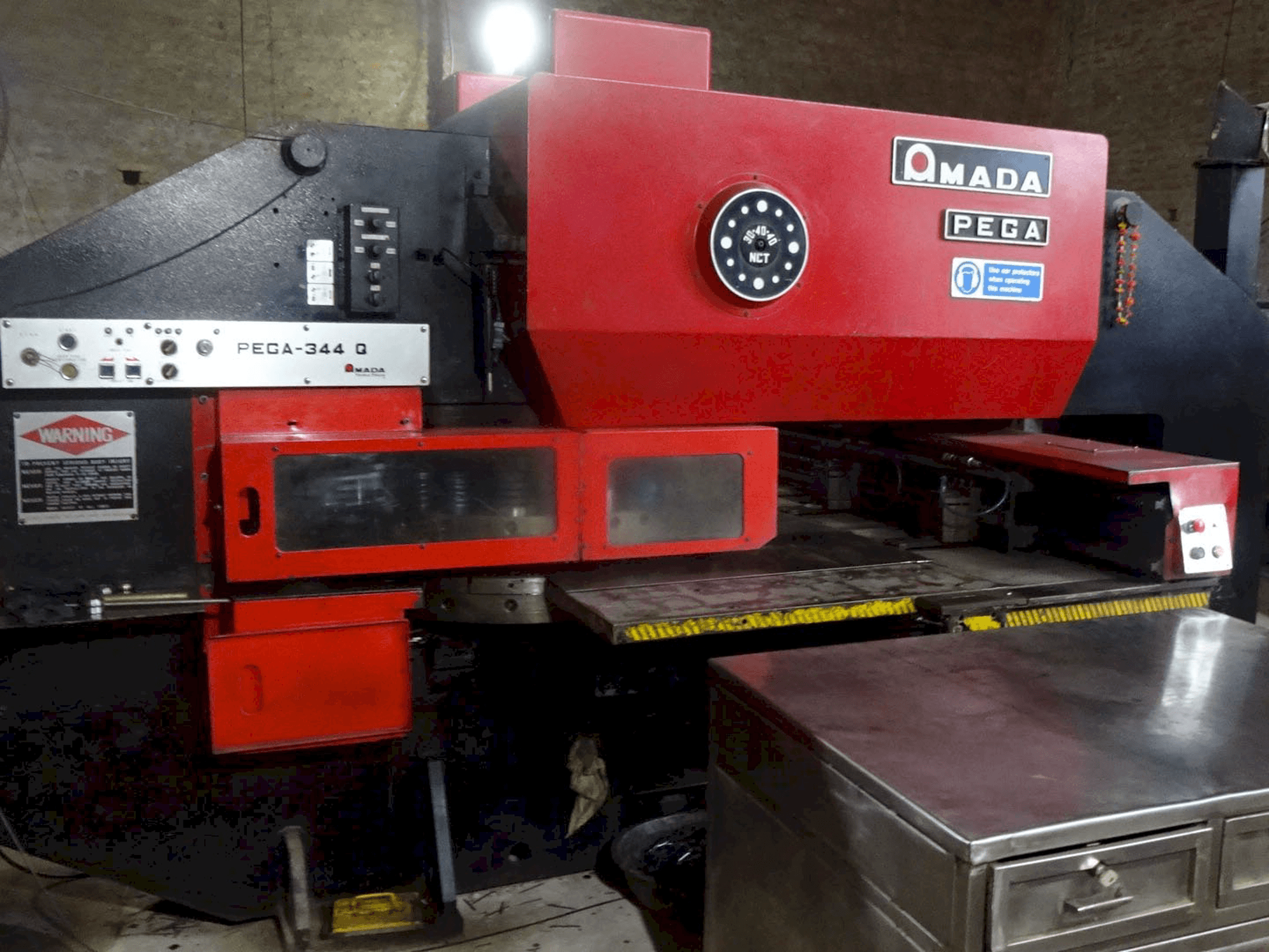 Left view of AMADA PEGA 344 Q Machine