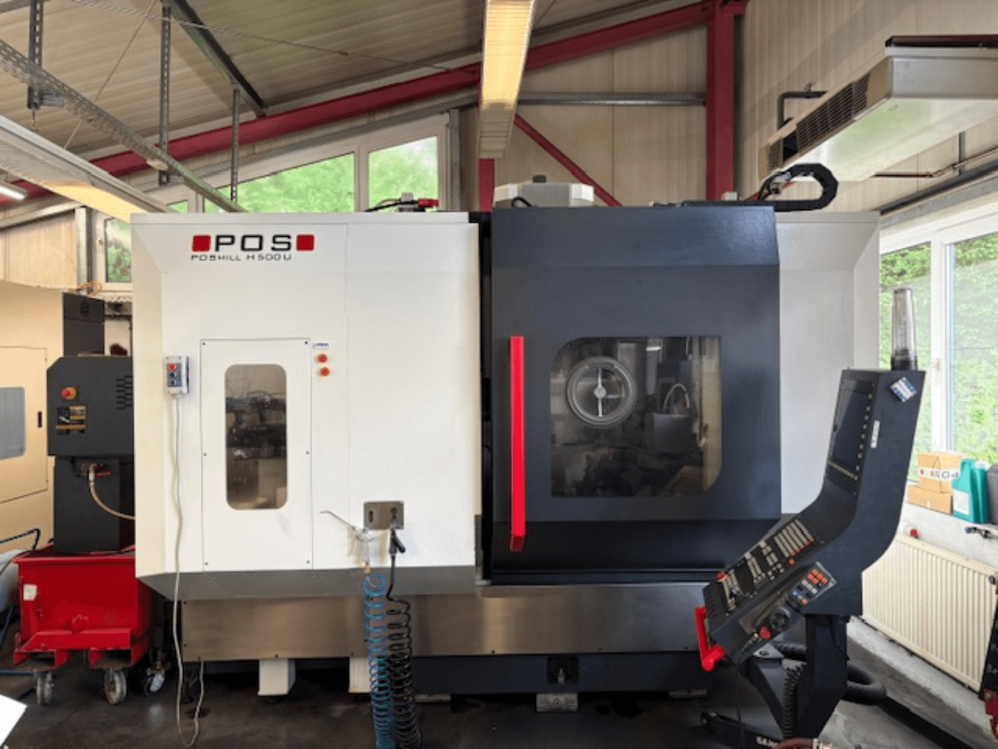 Фрезерний верстат POS POMILL H500 U вид спереду, з панеллю керування та робочим вікном.