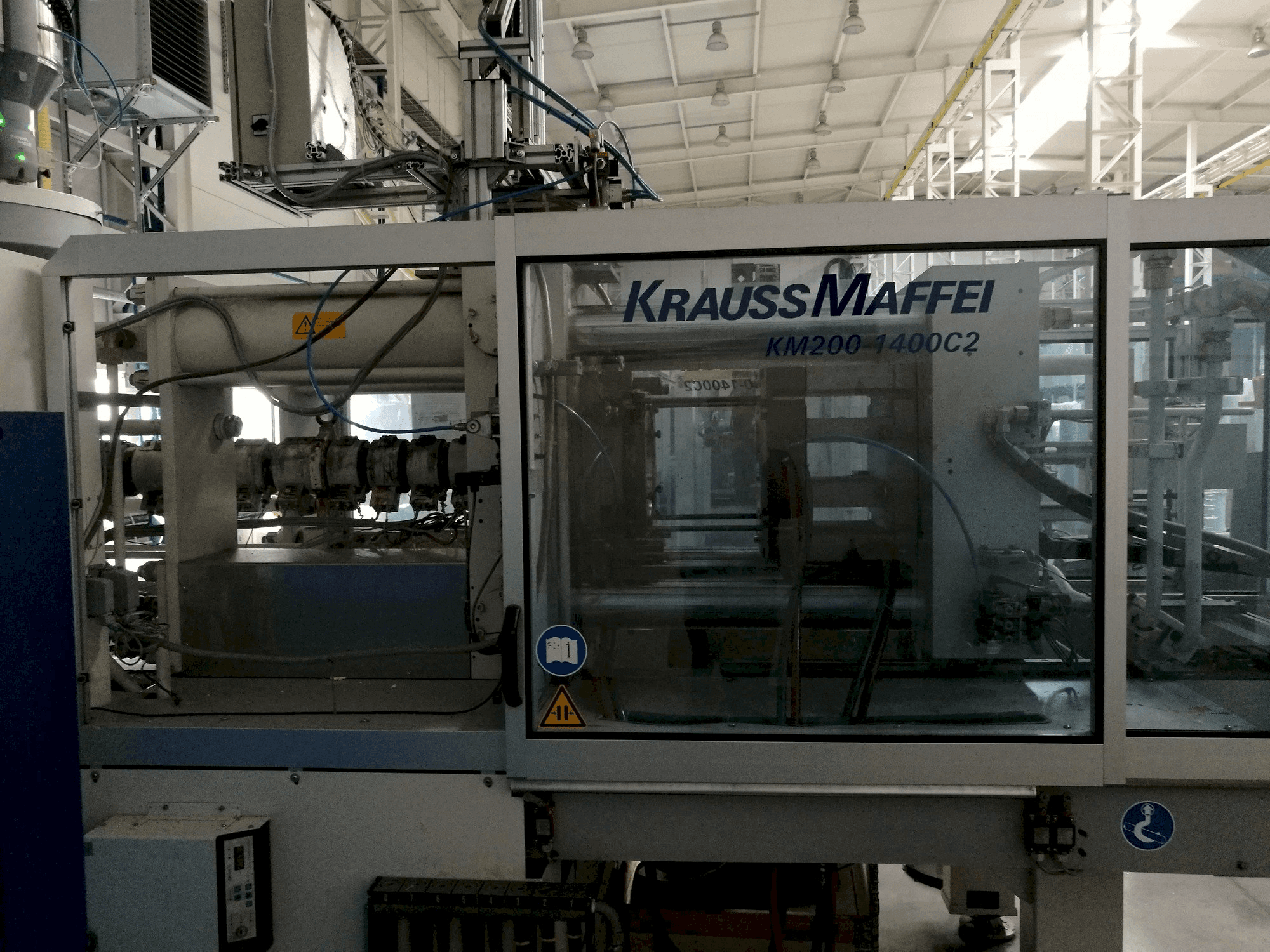 Front view of Krauss Maffei 200-1400 C2 machine