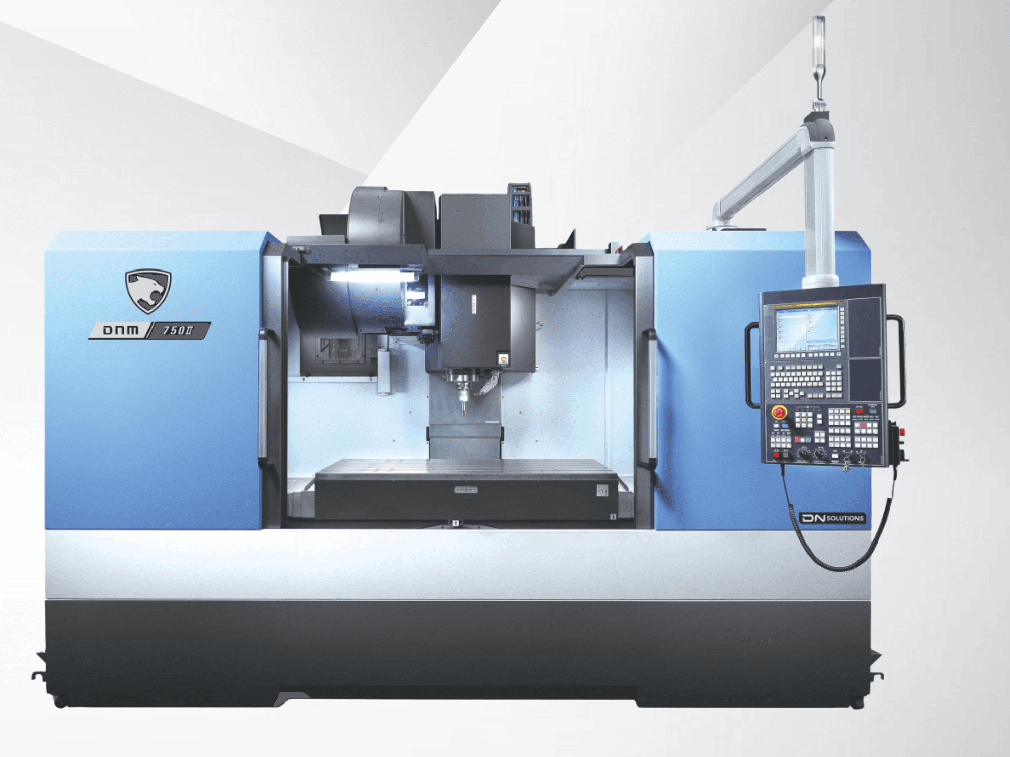 Вертикальний обробний центр DN SOLUTIONS DNM 750 II, вид спереду, з панеллю керування та відкритим робочим простором.